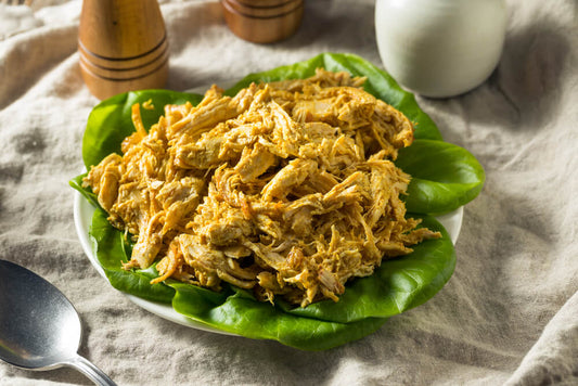 Wurzpott Gourmet Spices Smoky Curry Saffron Chicken Salad Sandwich on a sub roll with spice jars